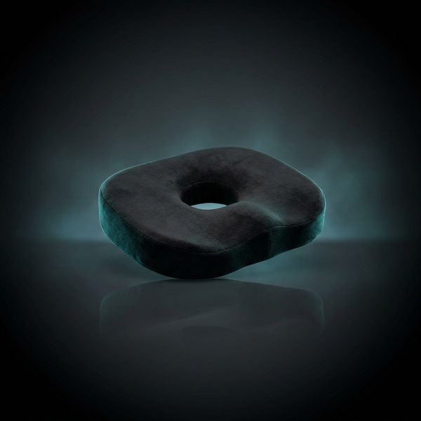 Memory foam donut seat cushion, dark studio product photo